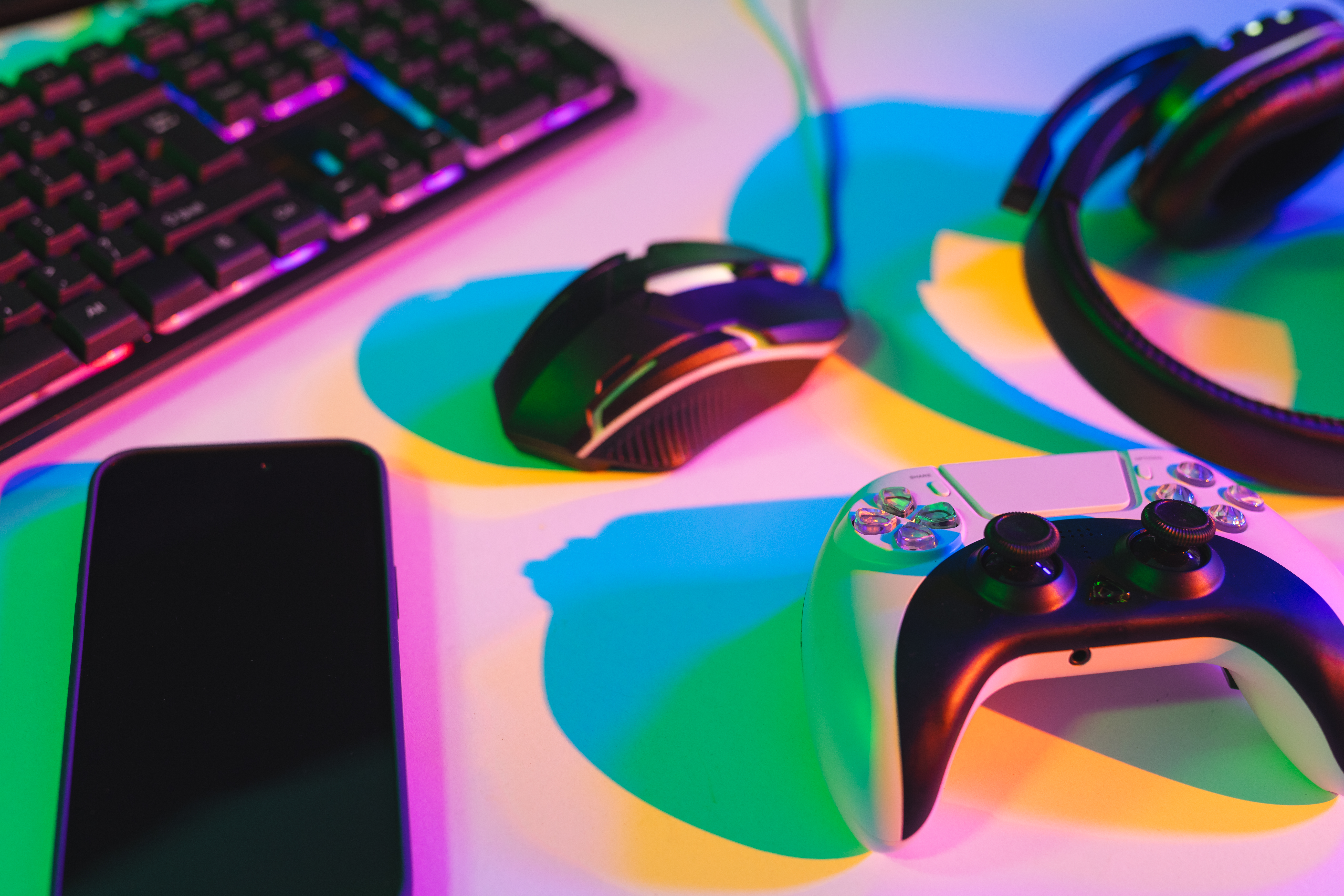 On a green background is a television screen, phone and Nintendo Switch showing the game Pig Eat Ball